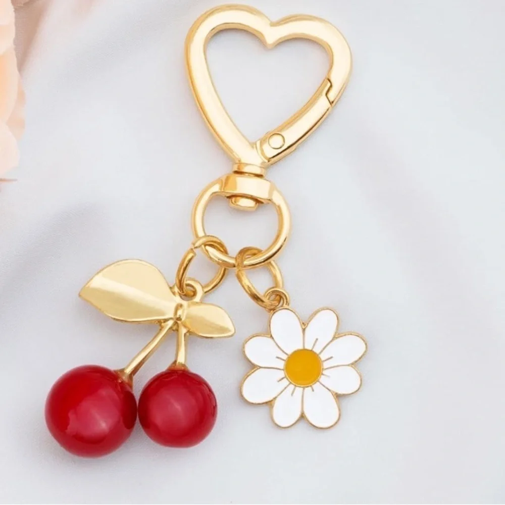 Red Cherry with Daisy bag accessories clip featuring gold hardware